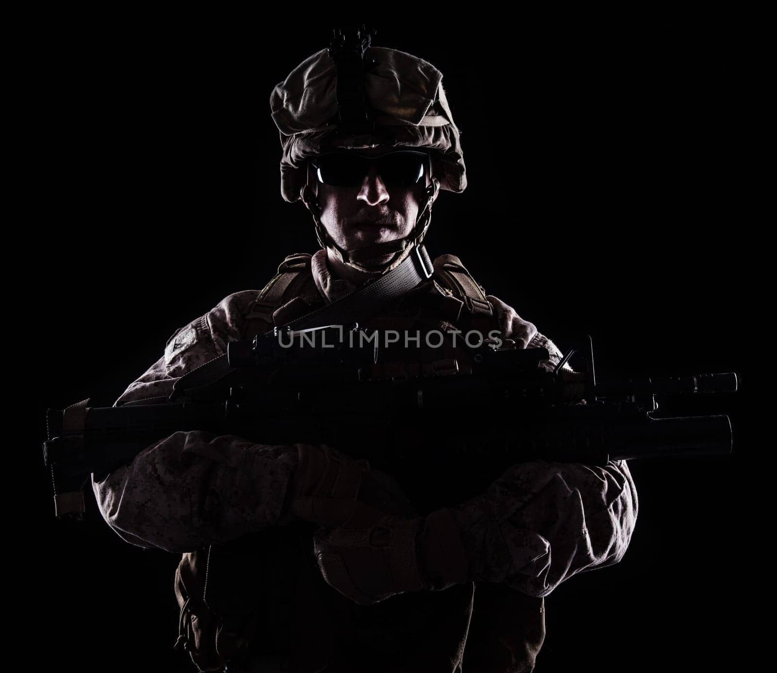 US marine with the rifle on black background