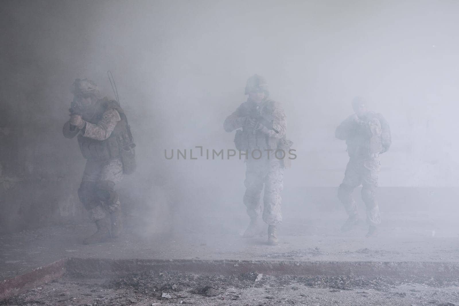 Squad of US marines in action in ruined building
