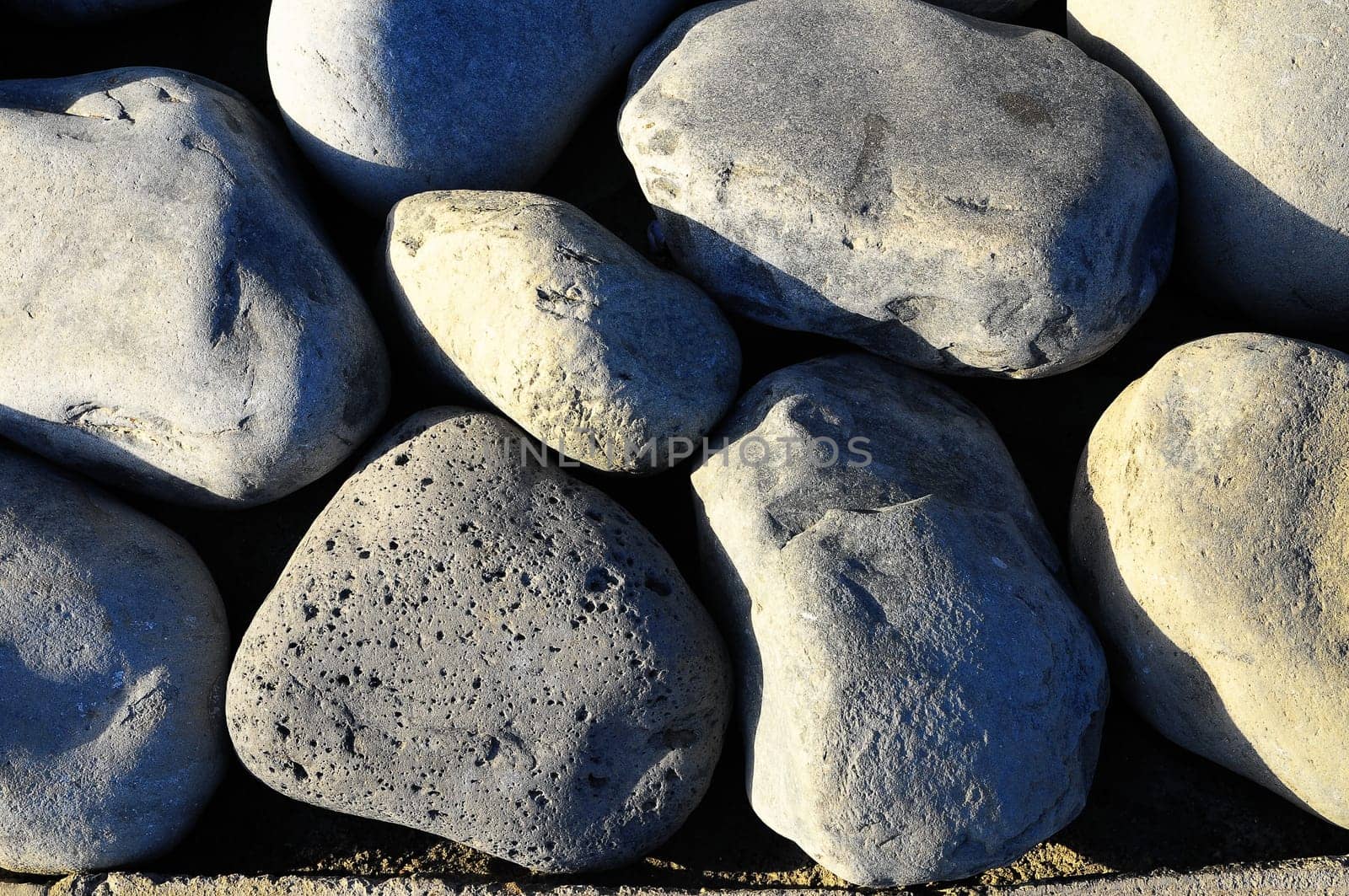 Texture of Round Rocks Smoothed by the Water