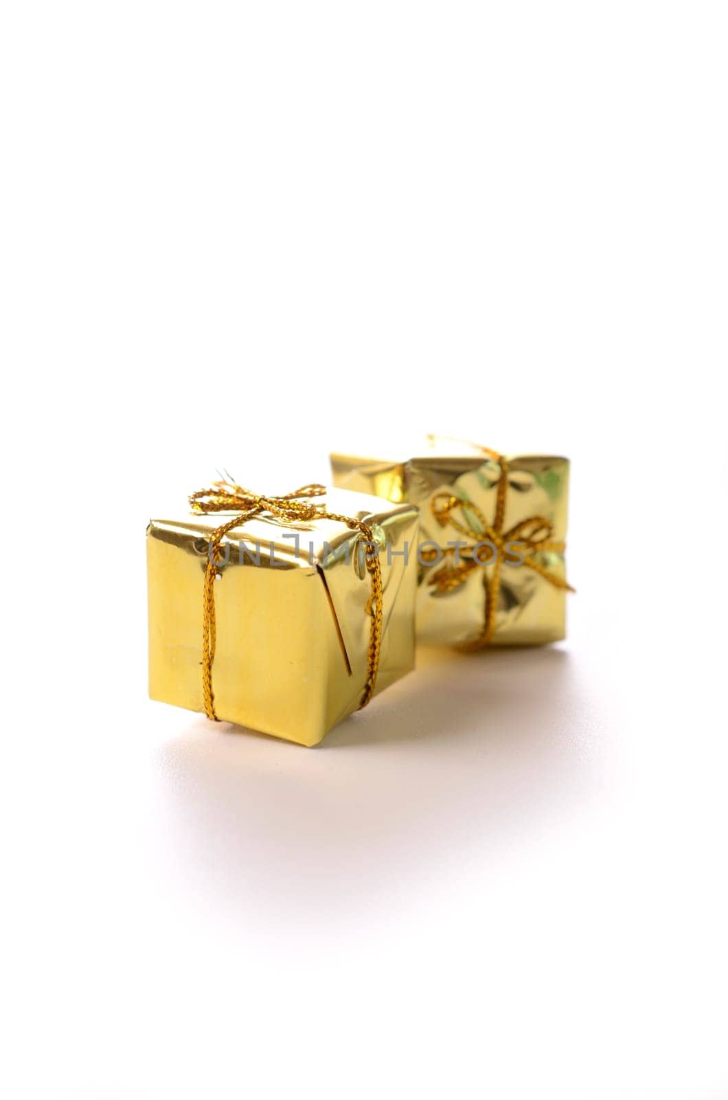 Golden gift boxes on a white background
