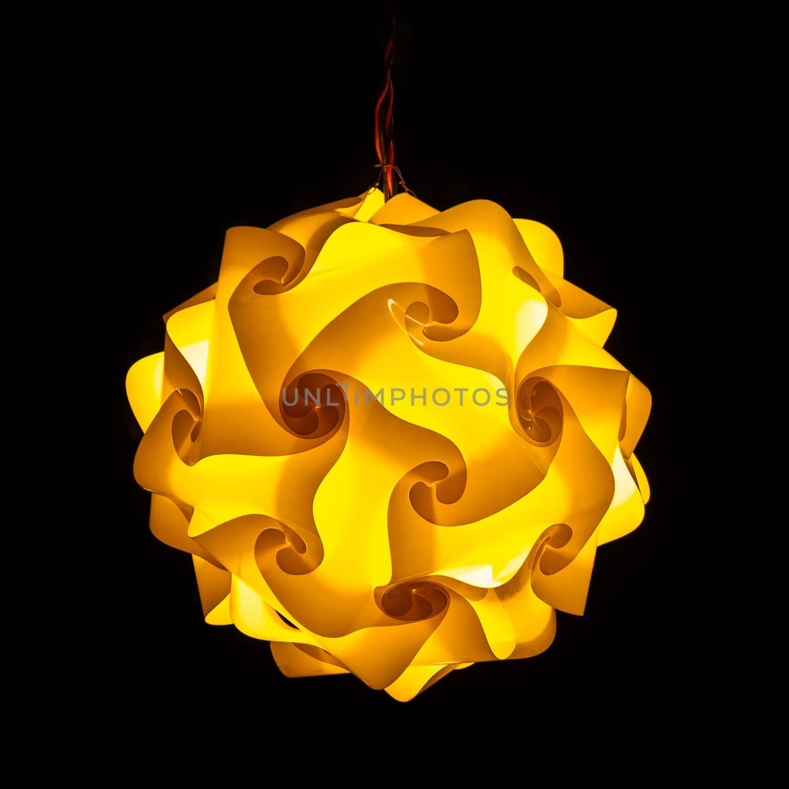 Yellow street lamp on black background
