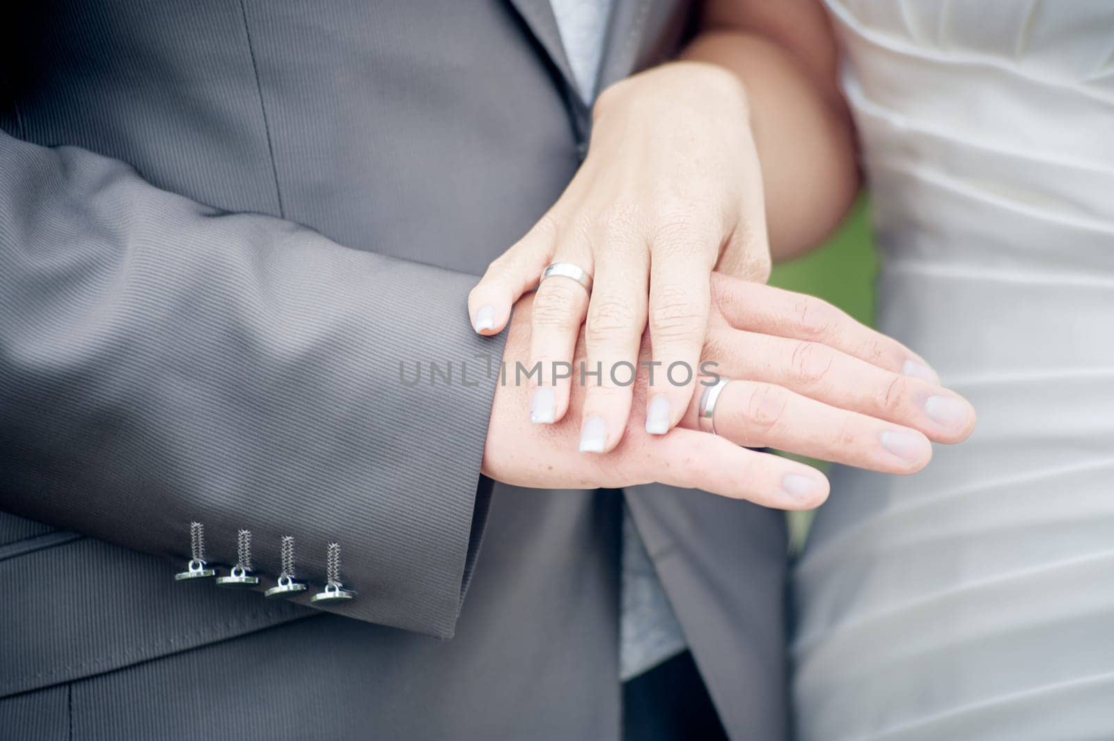 Bride and Groom showing their rings