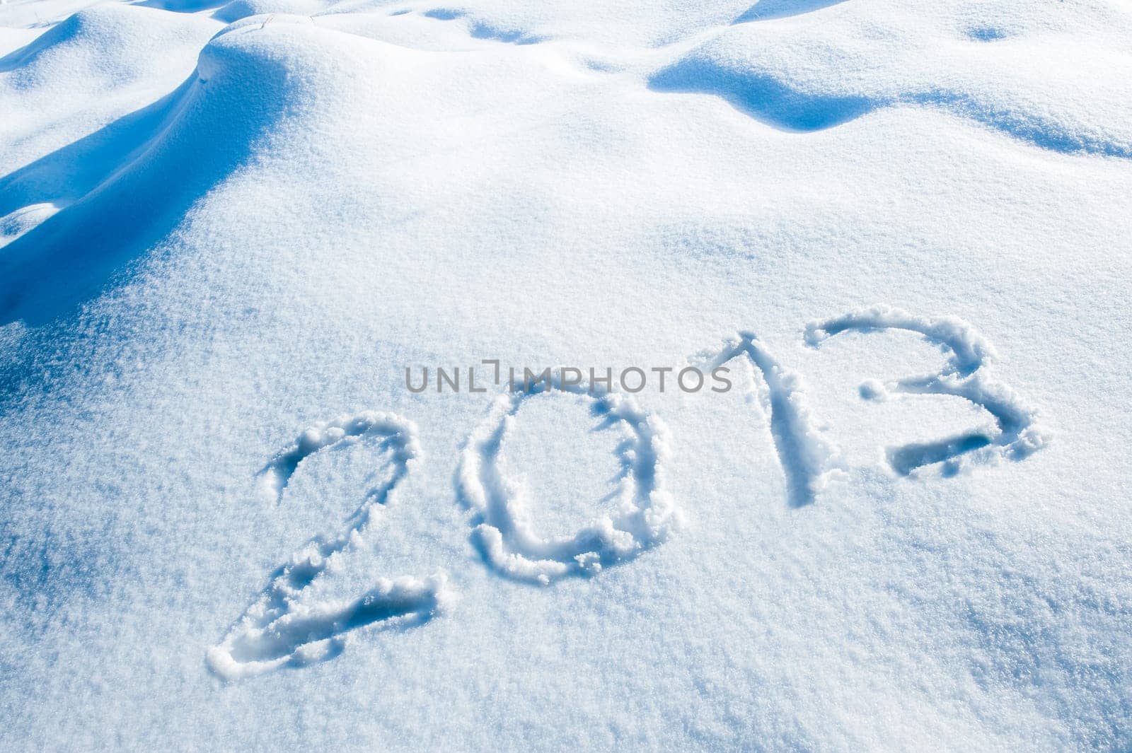 Year 2013 written in a winter landscape