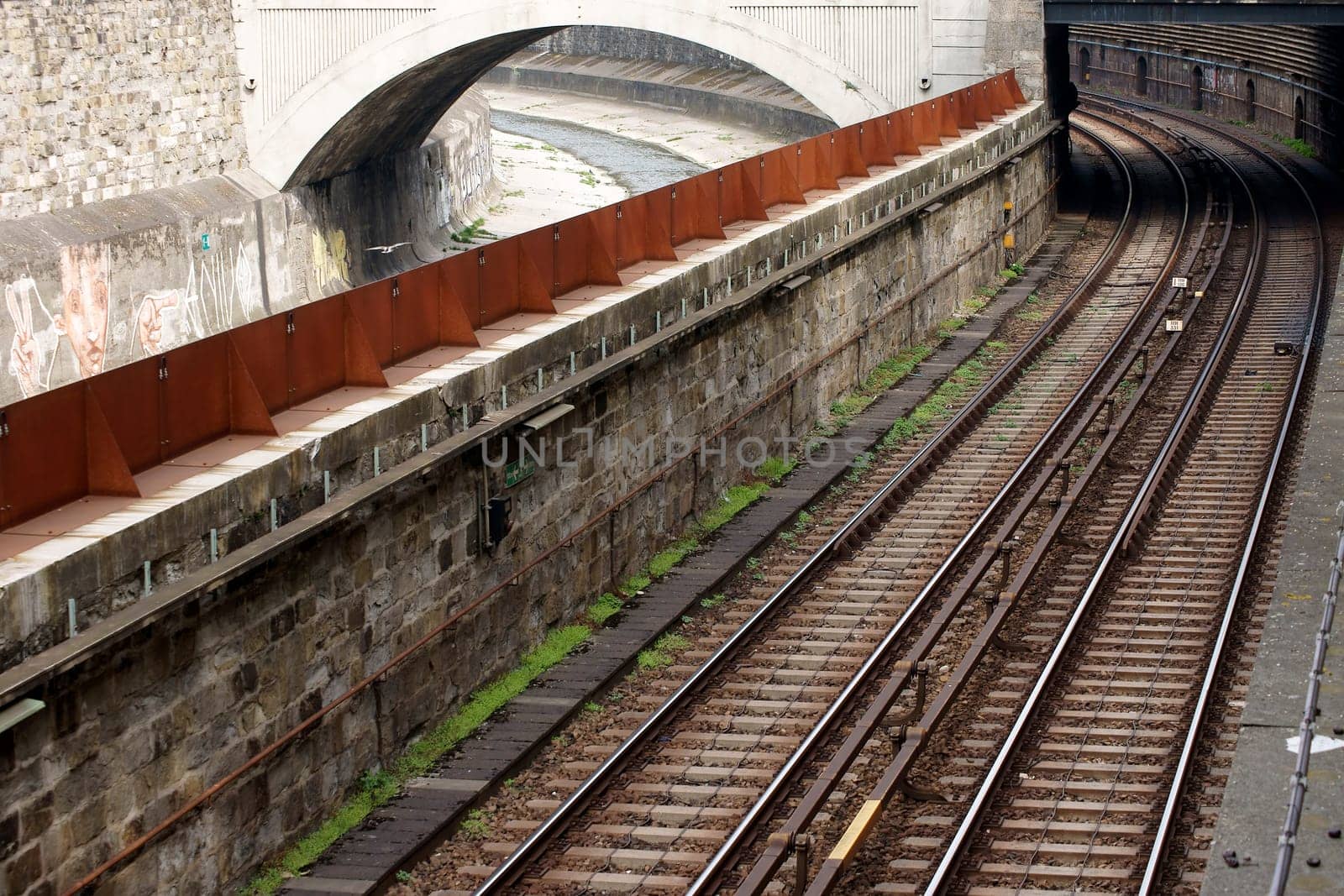 The photograph of the Austrian tram network with an adjacent water canal.
