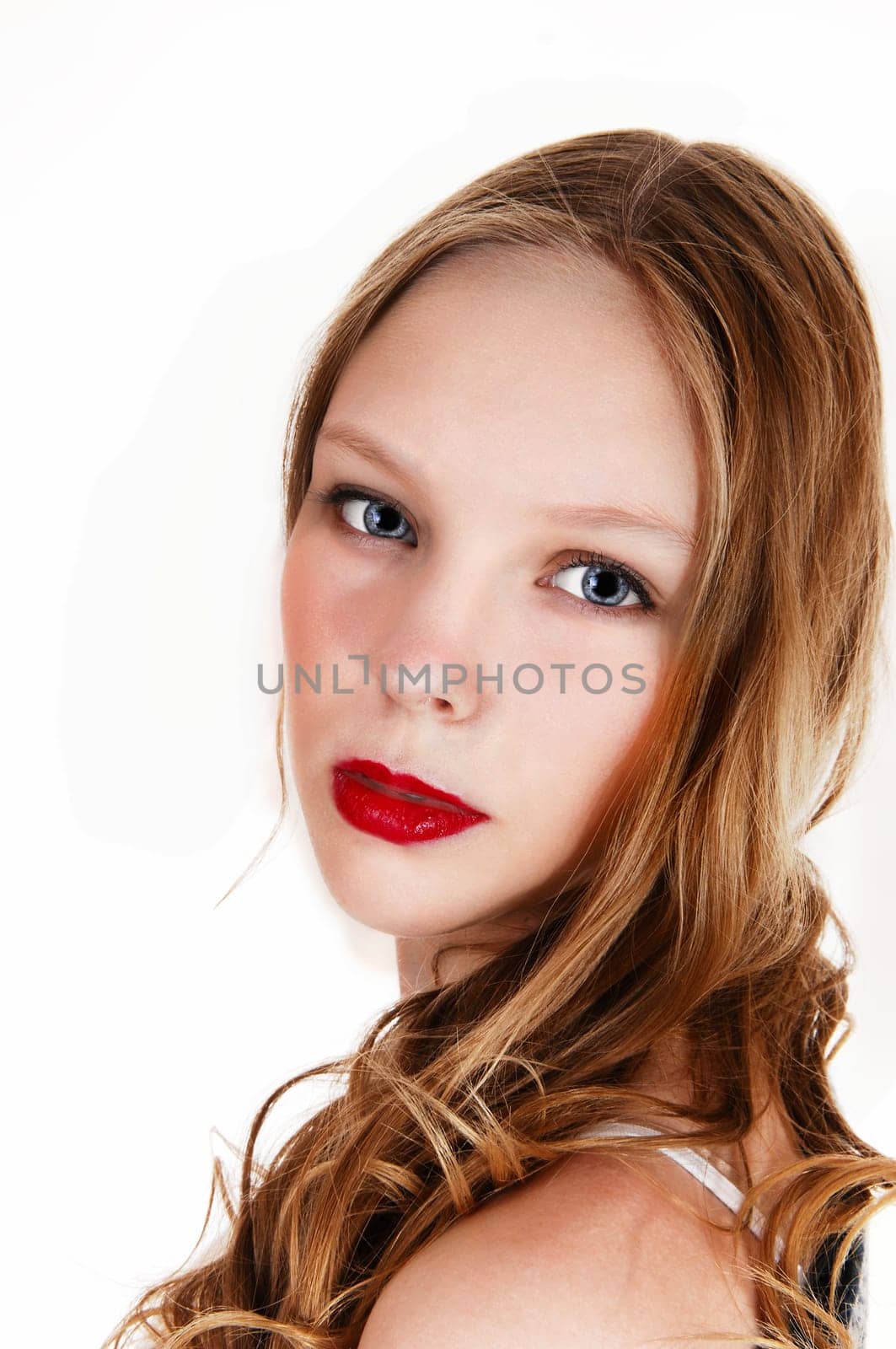A closeup picture of a beautiful young teenager with long blond hair.and blue eyes, isolated for white background..