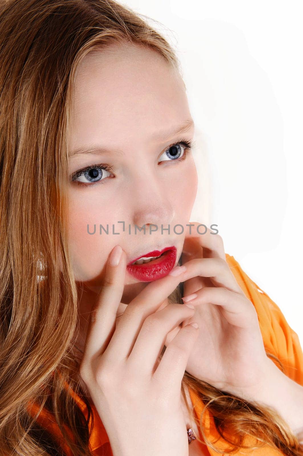 A closeup picture of a lovely teenager with blue eye's and long blond.hair, isolated for white background..