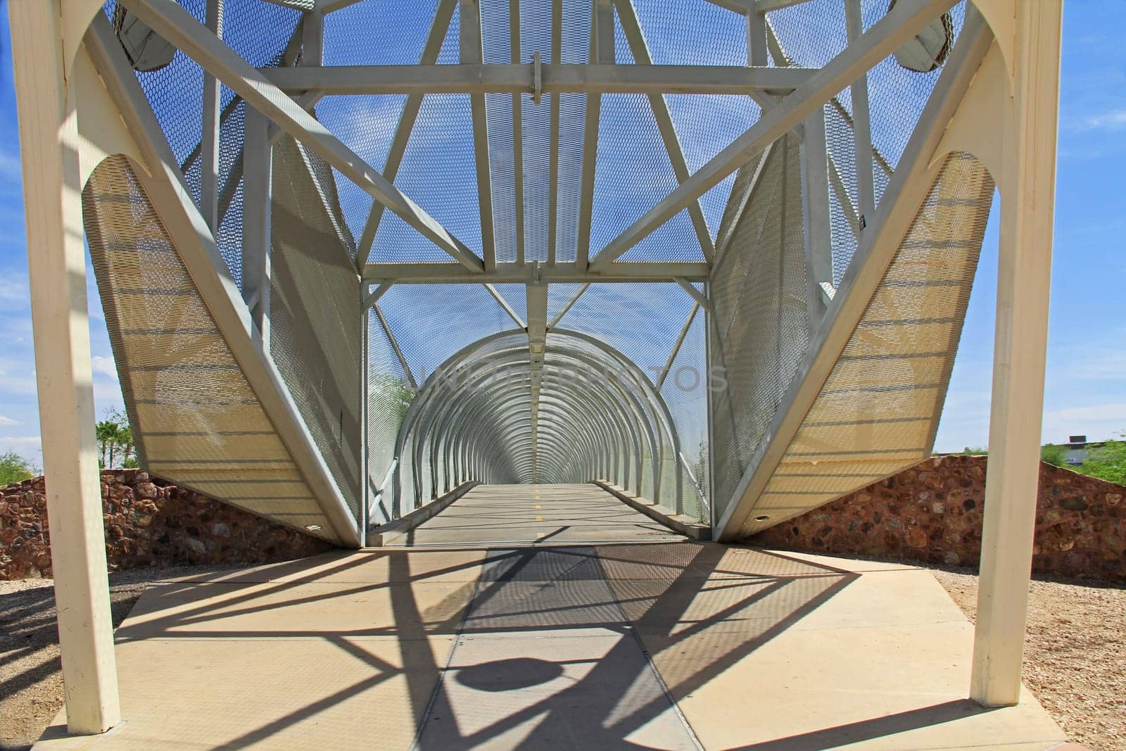 Inside the tail end of the diamondback rattlesnake bicycle and pedestrian covered bridge over Broadway Blvd. at the Barraza-Aviation Parkway, just east of downtown Tucson, Arizona.