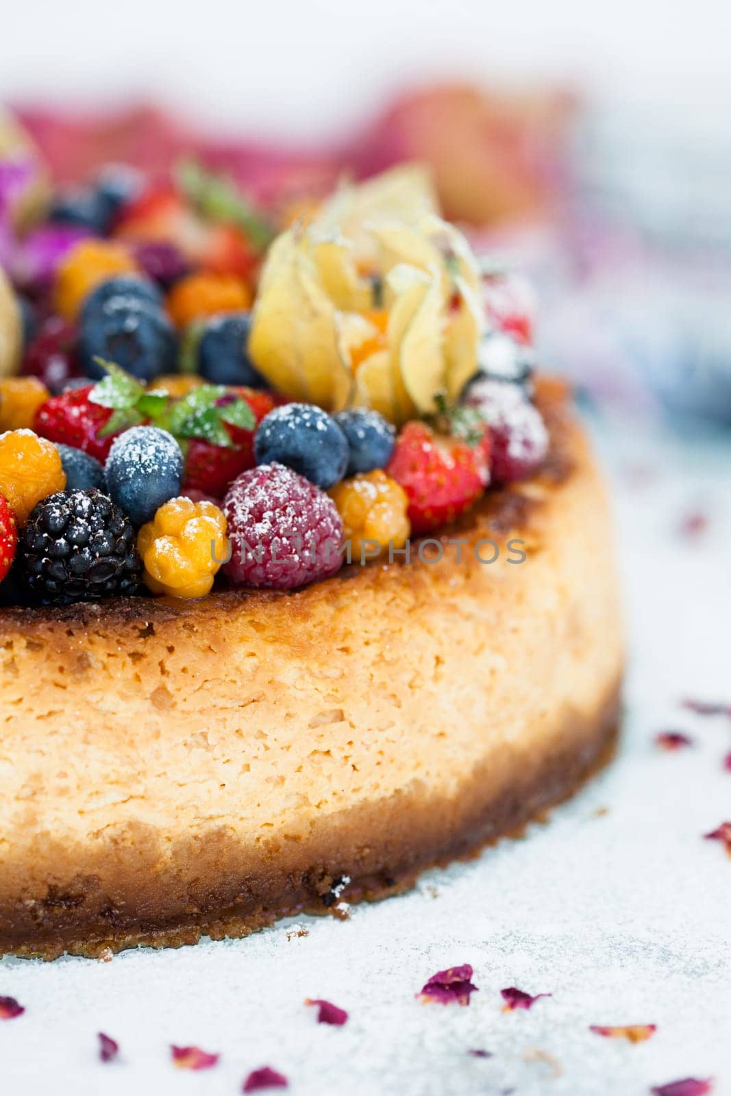 Closeup of delicious sponge cake topped with fresh berries