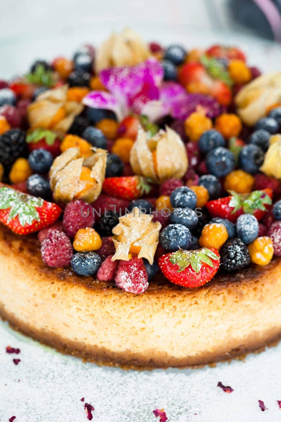 Closeup of delicious sponge cake topped with fresh berries