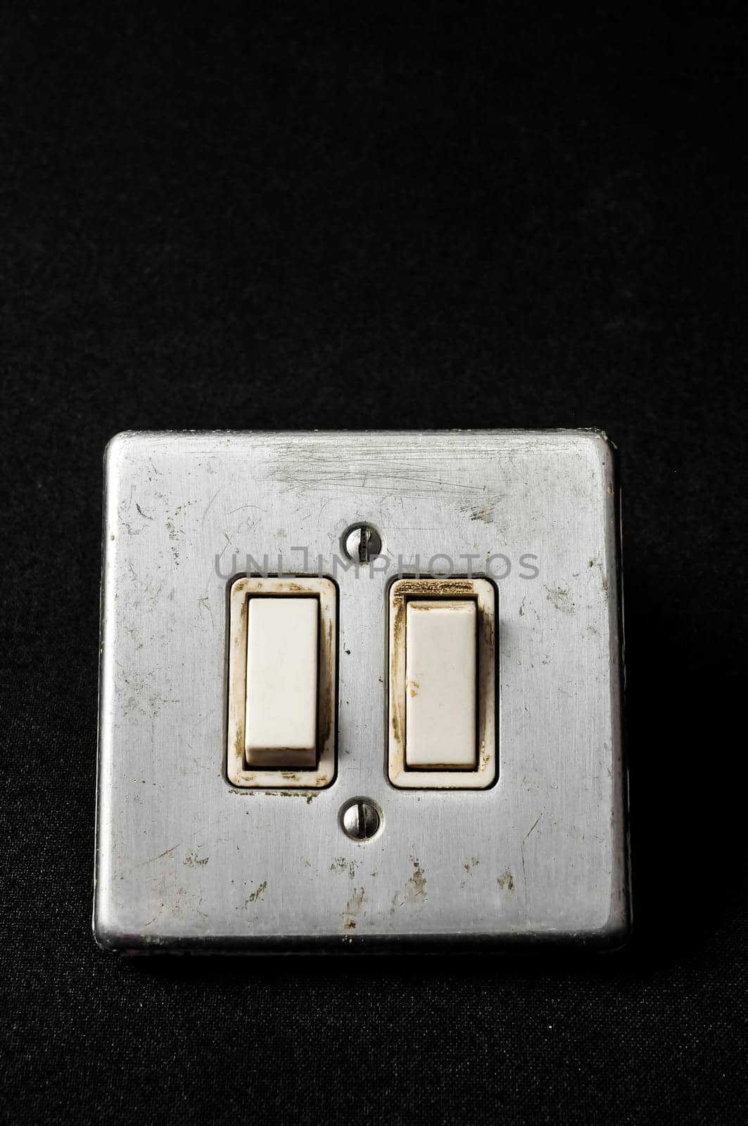 Light switch, old-style on a Black Background