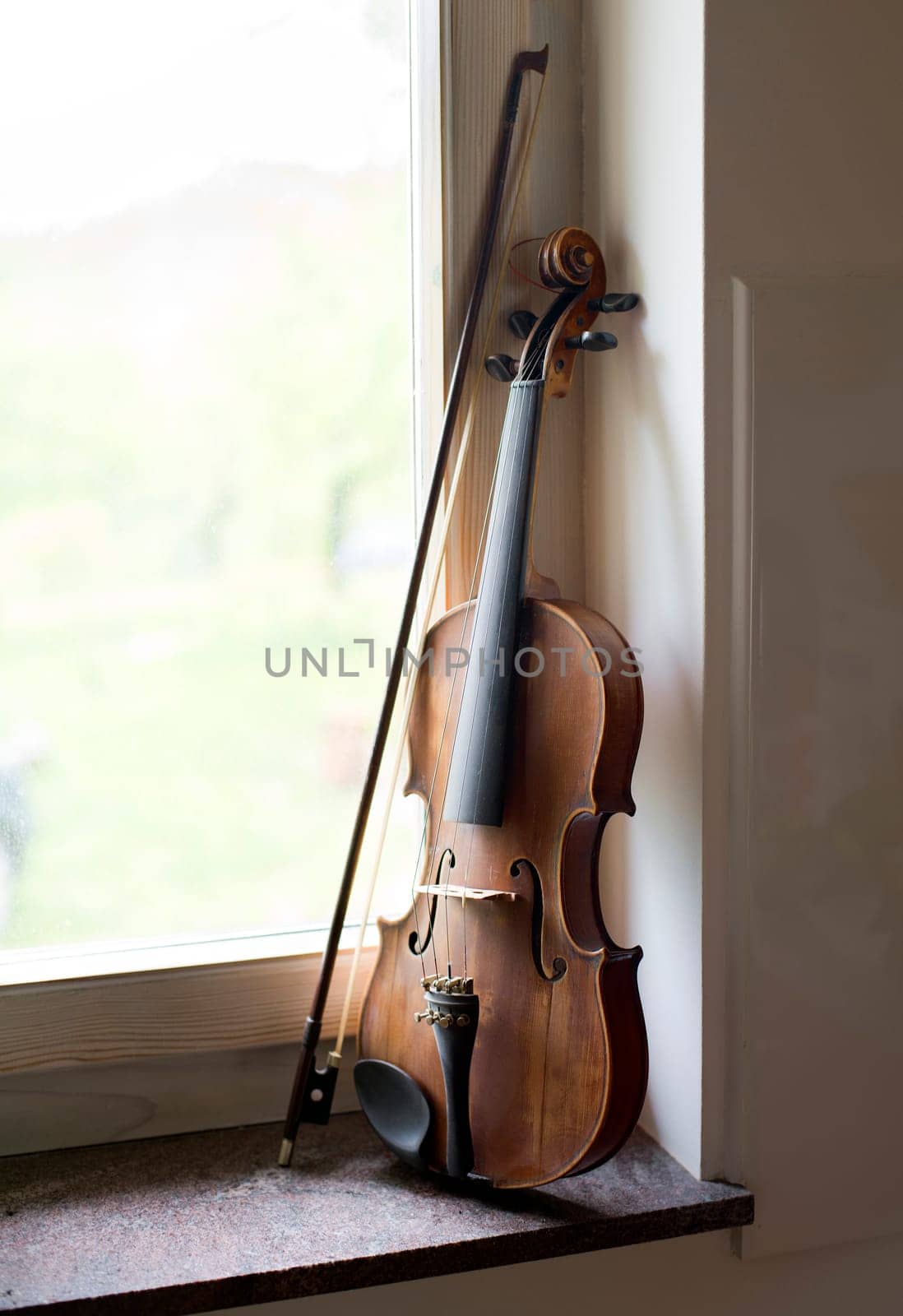 Violin beside window light close up shoot