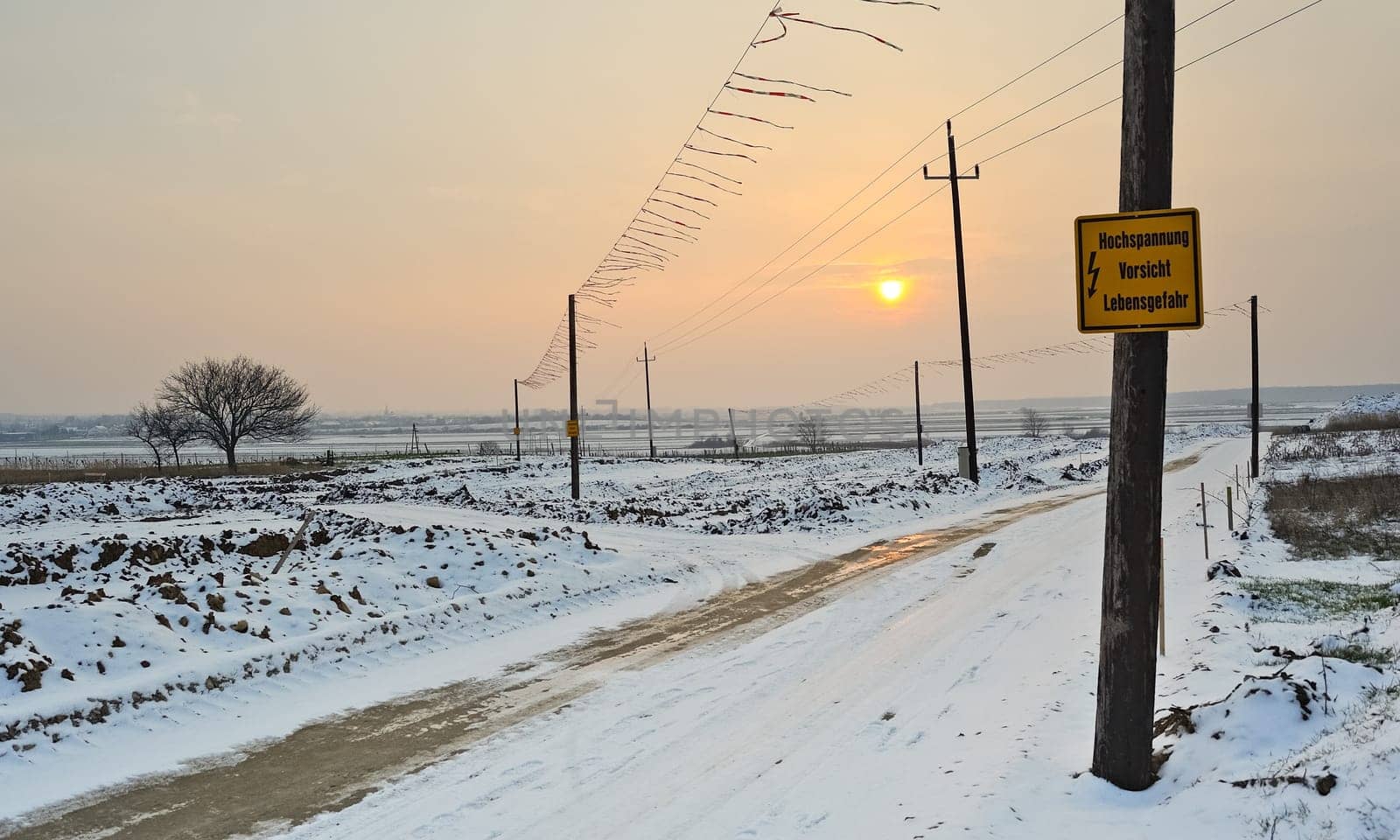 Gravel road at construction site in winter