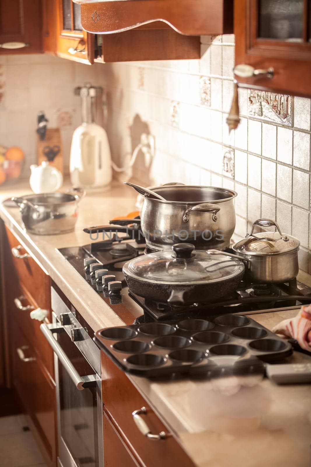 Closeup photo of metal saucepan boiling on stove