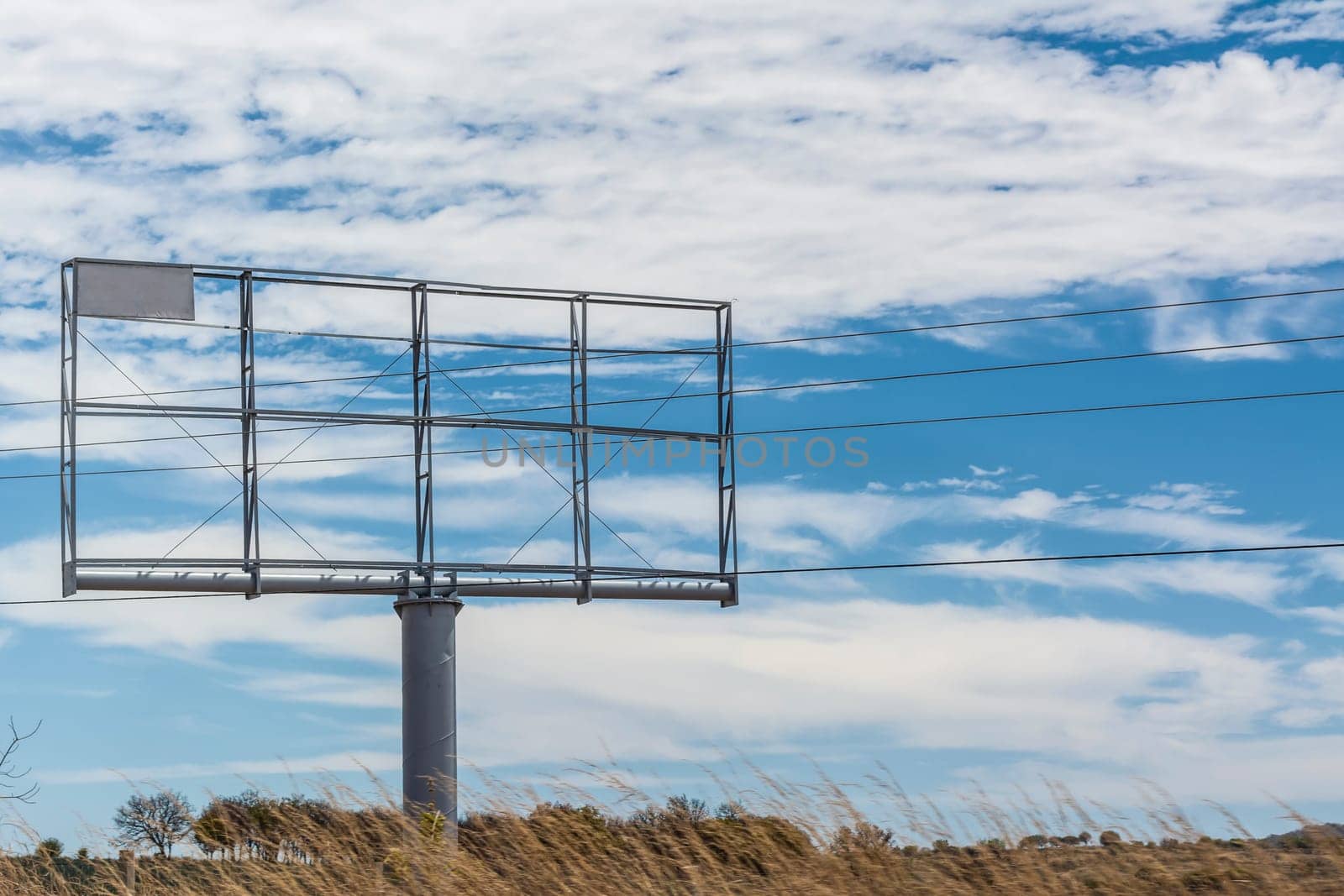 Rural billboard against blue sky