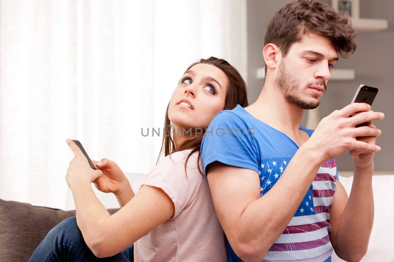 couple problems in which the woman can't speak to the man because he's texting with his mobile phone and ignores the girl