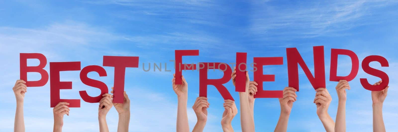 hands holding four pieces of a puzzle with copy space, gray background