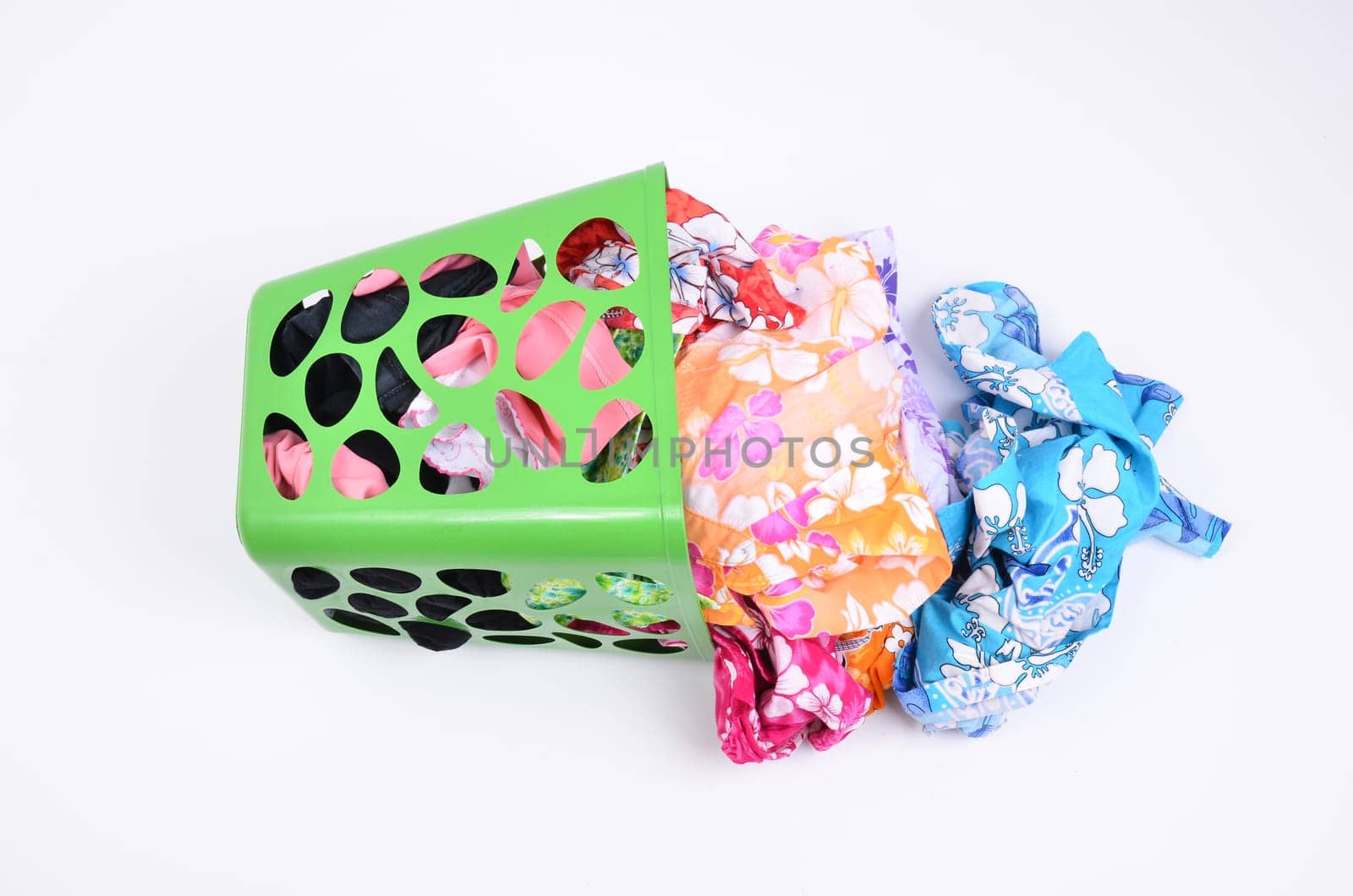 unwashed cloth in the basket on white background