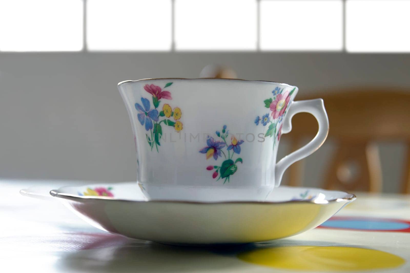 an old fashioned tea cup on a restaurant table