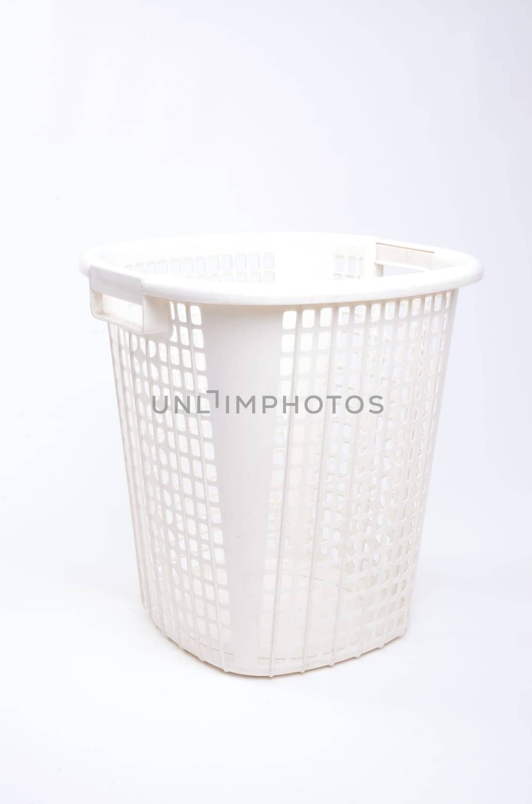 white plastic basket isolated on white background