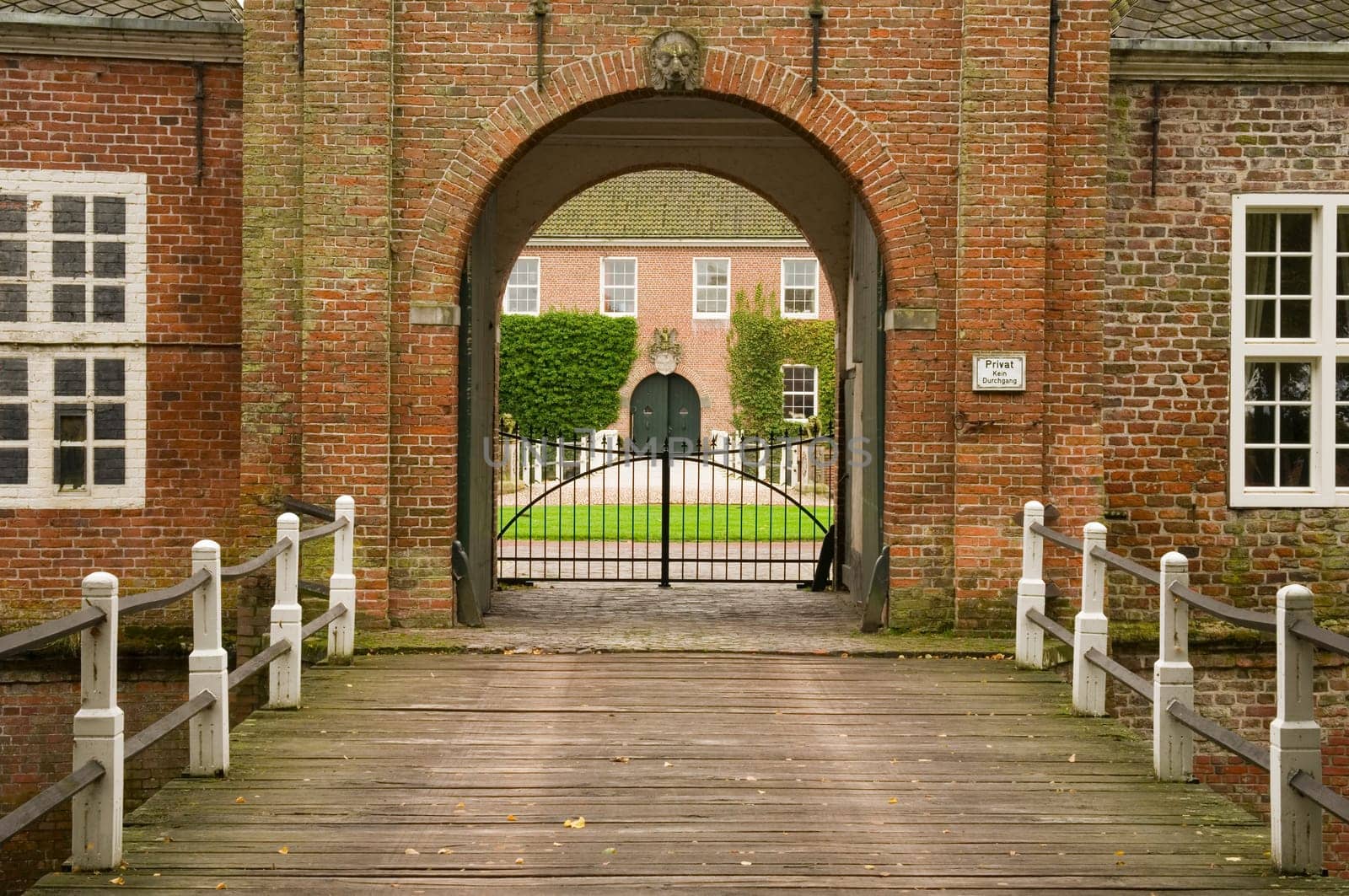 Bridge with entrance gate of Luetetzburg Castle in East Frisia / Germany