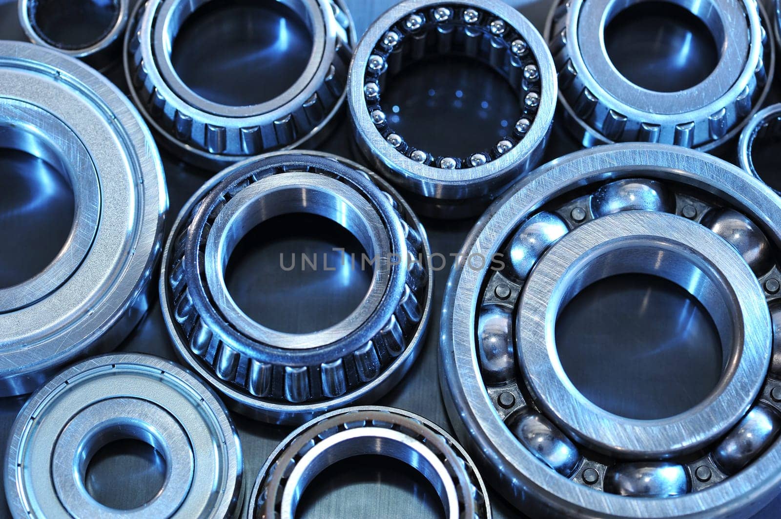 Close-up of various ball bearings in blue light