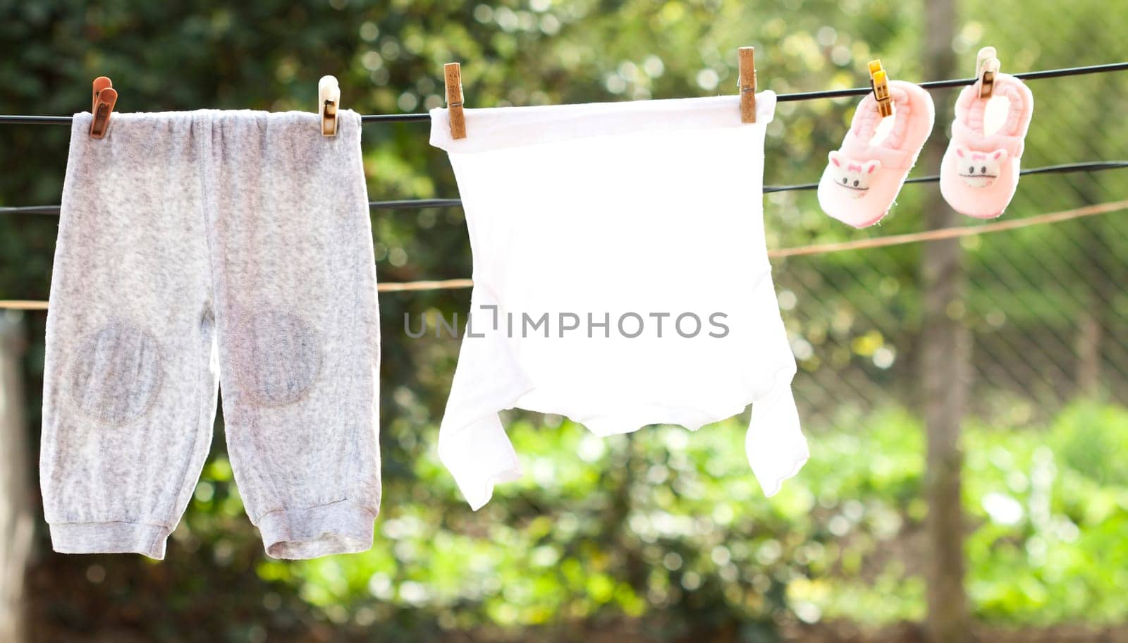 Small Baby clothes hanging on the clothesline