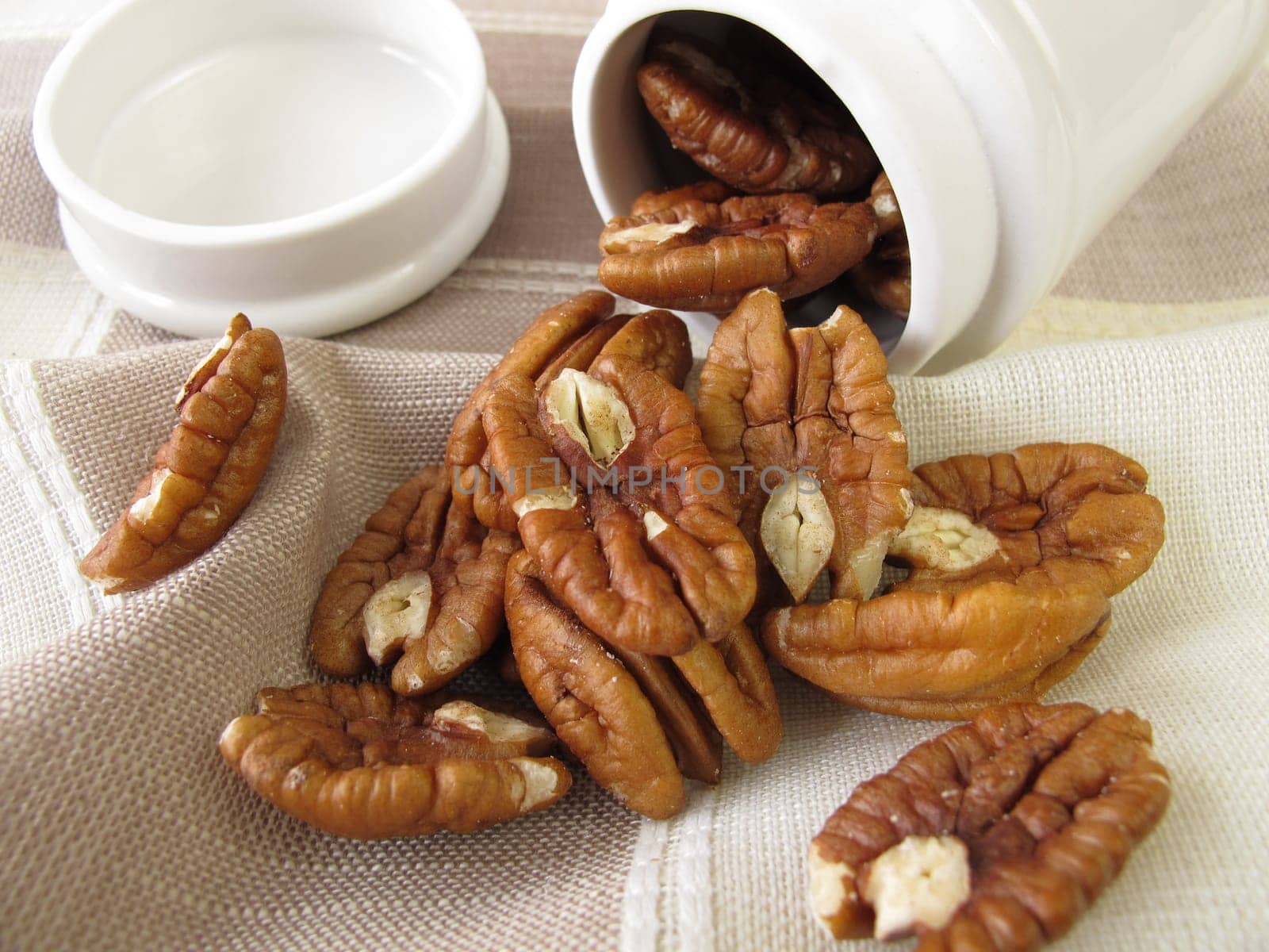 Pecans in a porcelain tin