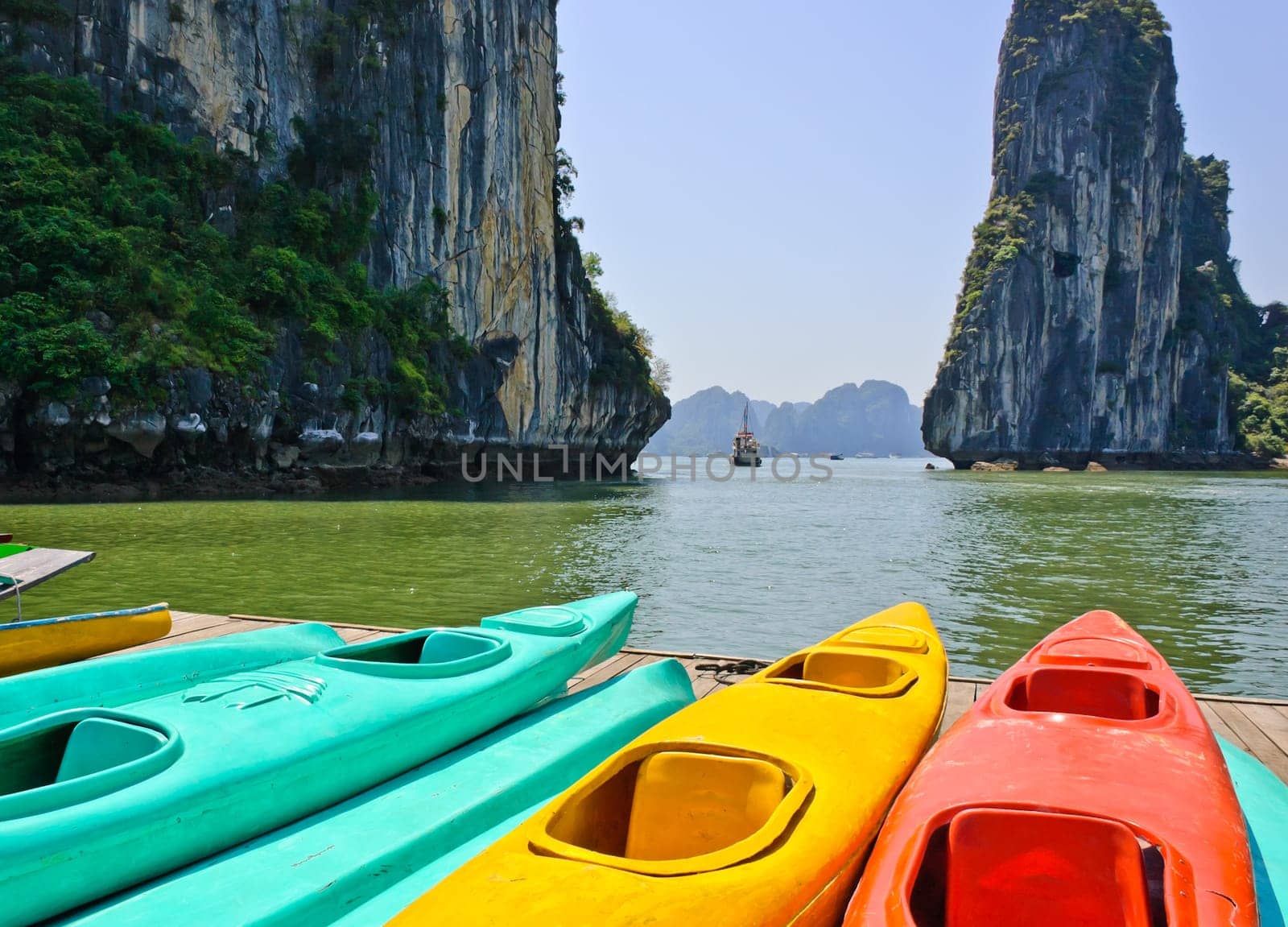 Colourful kayaks with limestone mountains background
