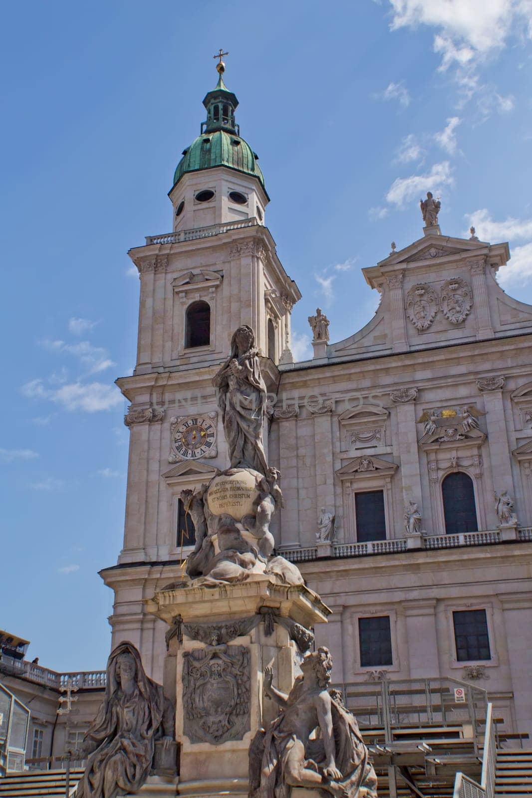 The facade of the Basilica of St. Peter in Salzburg (Austria). Marian column, whose peculiarity is the base of a marble and statue of the lead.
