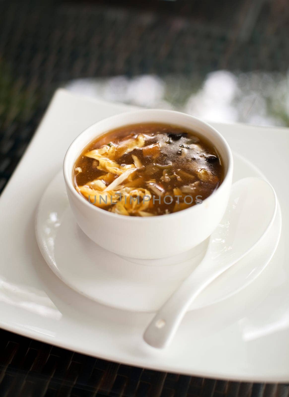 Sweet and sour chinese soup in restaurant close up
