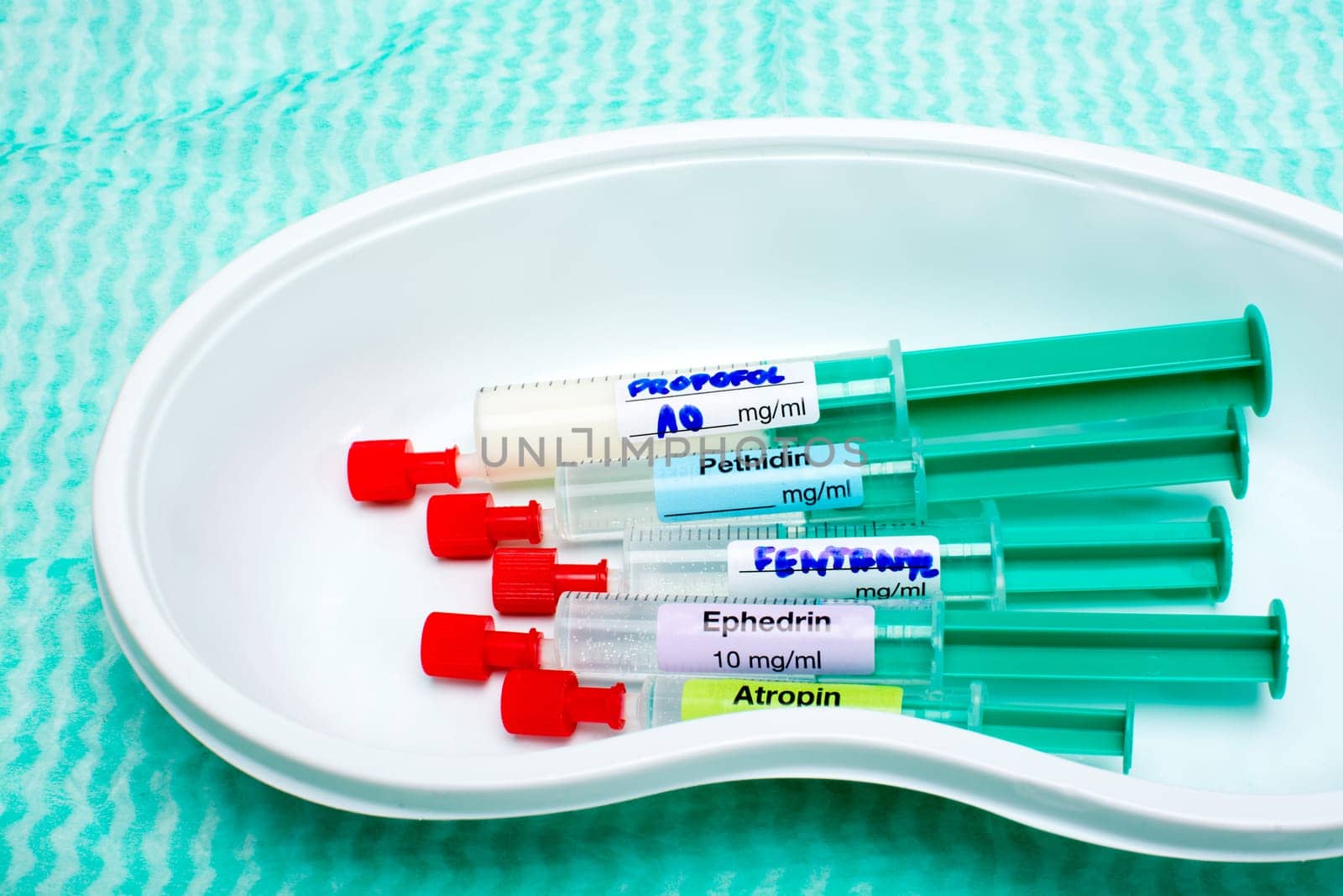 Anaesthetic induction syringes in a kidney dish