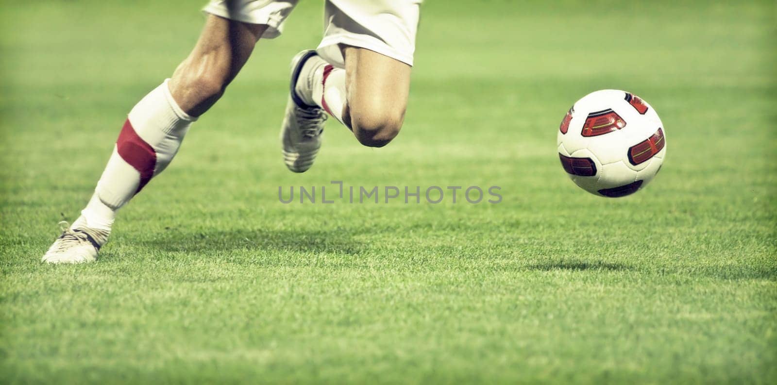 Soccer player running after the ball