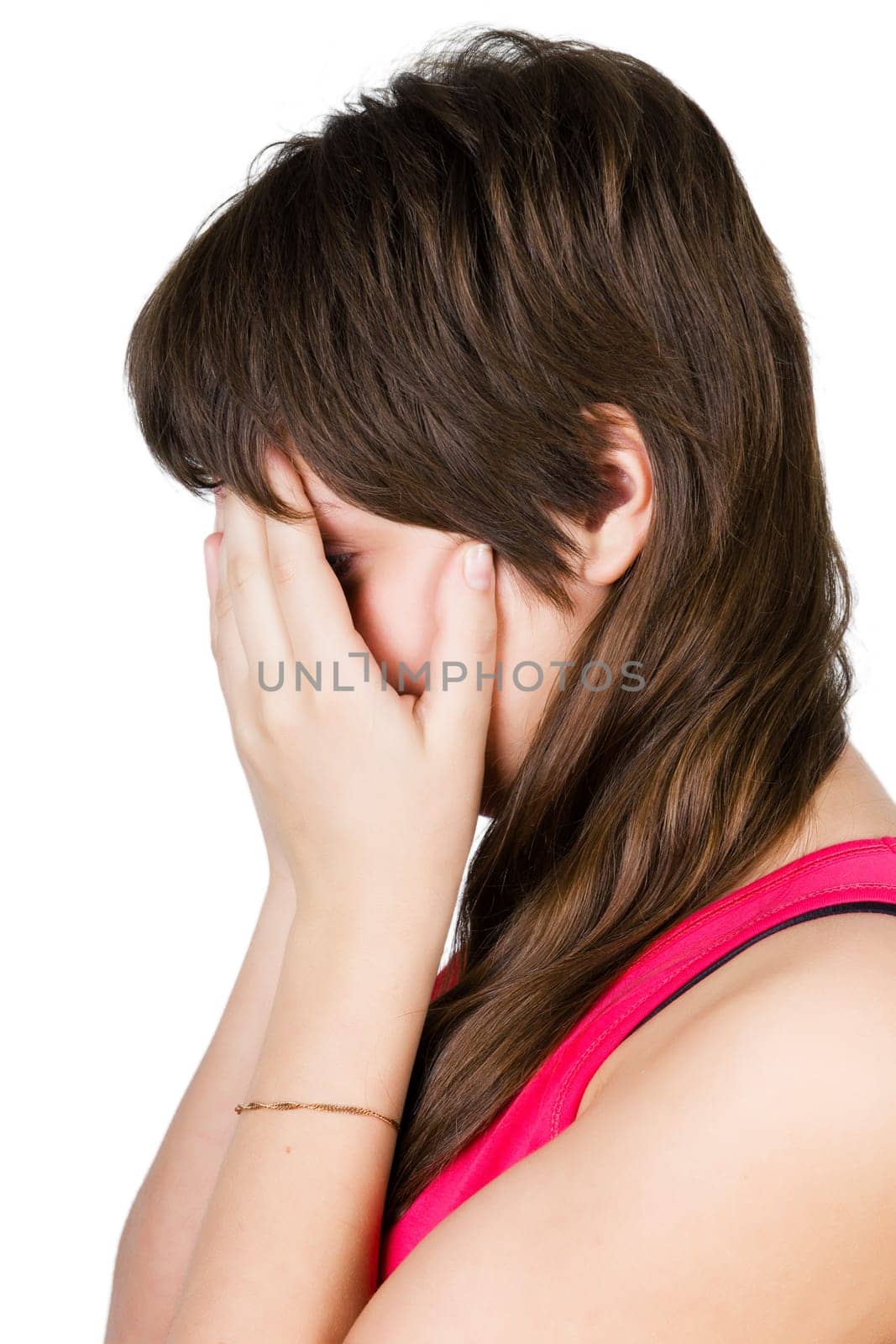 beautiful young girl crying. isolated on white background