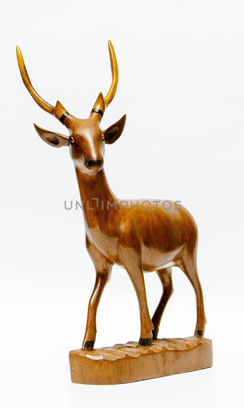 the Carved wooden deer with white background