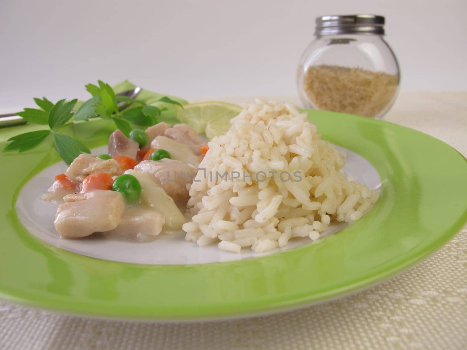 Chicken frying with carrots,peas and asparagus