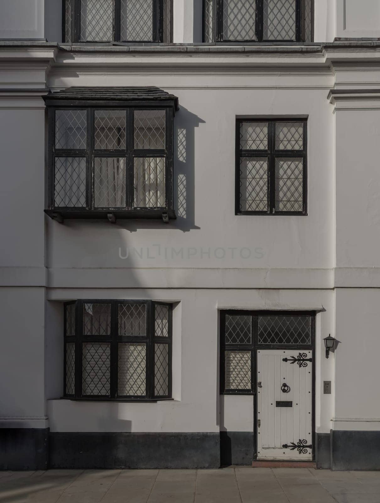 London, UK - Oct 24, 2023 - Facade of a house in De Vere Cottages and street light at South Kensington. Space for text, Selective focus.