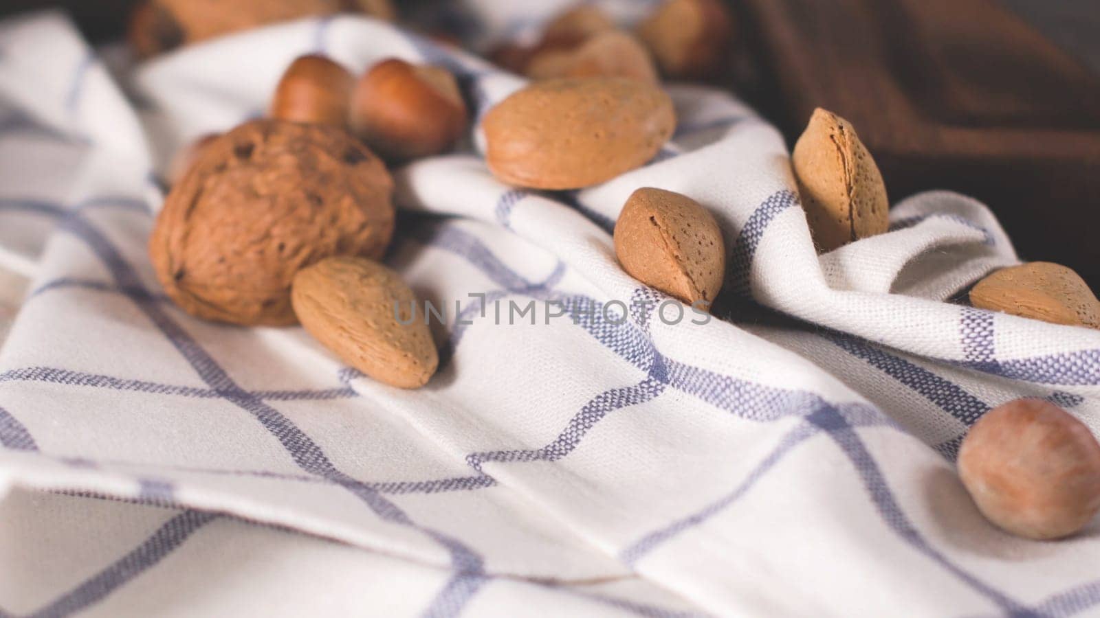 Dry fruits on wooden table by homydesign