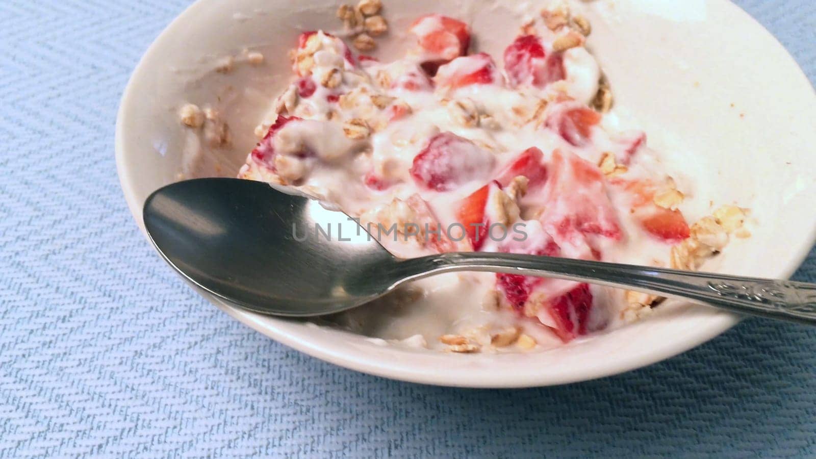 Yogurt with cereal and strawberries by homydesign