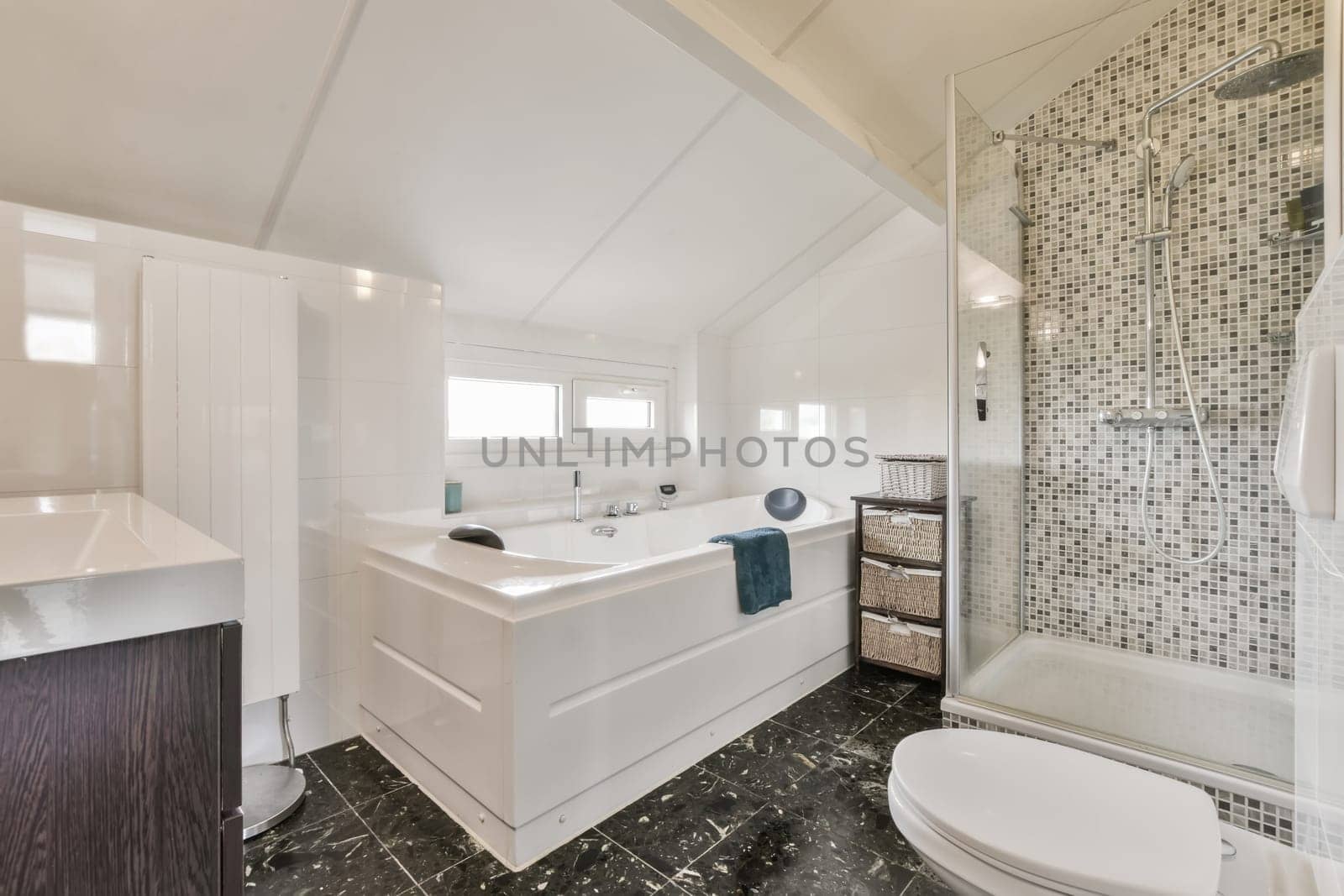 a white bathroom with a large tub and a sink by casamedia