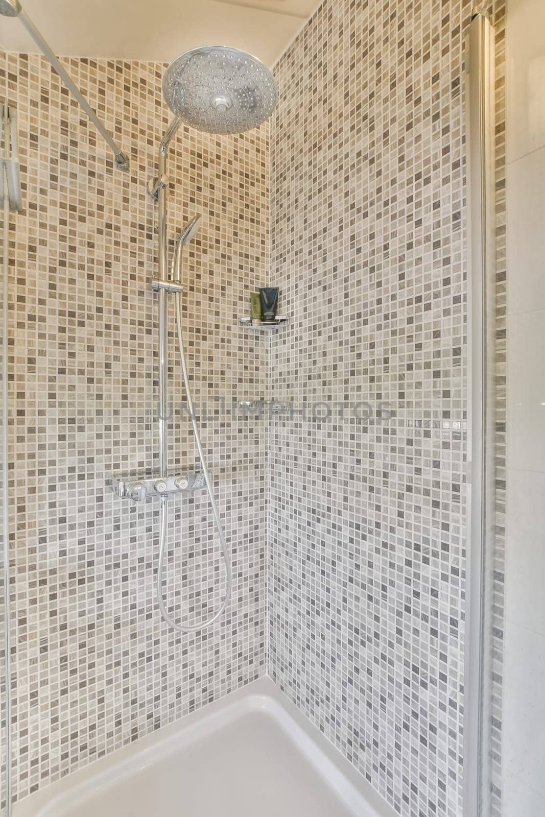 a white tiled shower with a shower head in by casamedia
