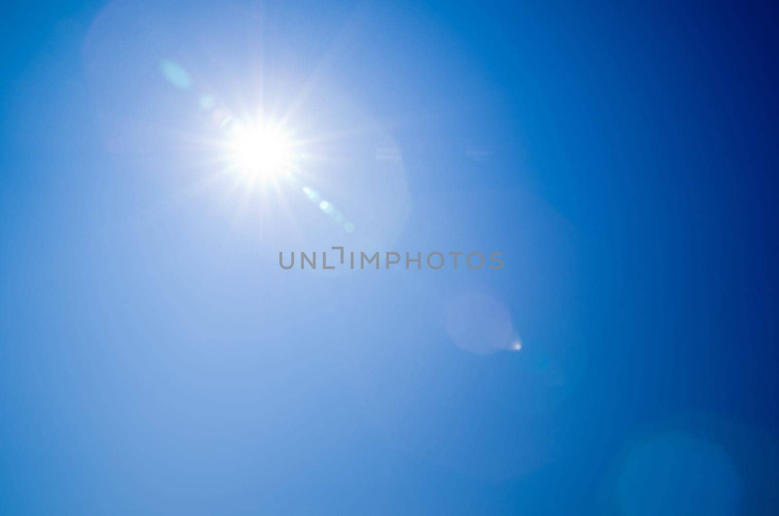 Shining sun at clear blue sky