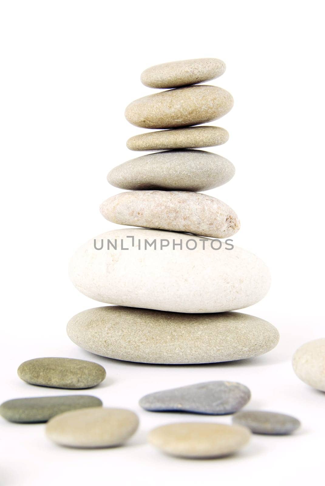 Stack of balanced stones on a white background
