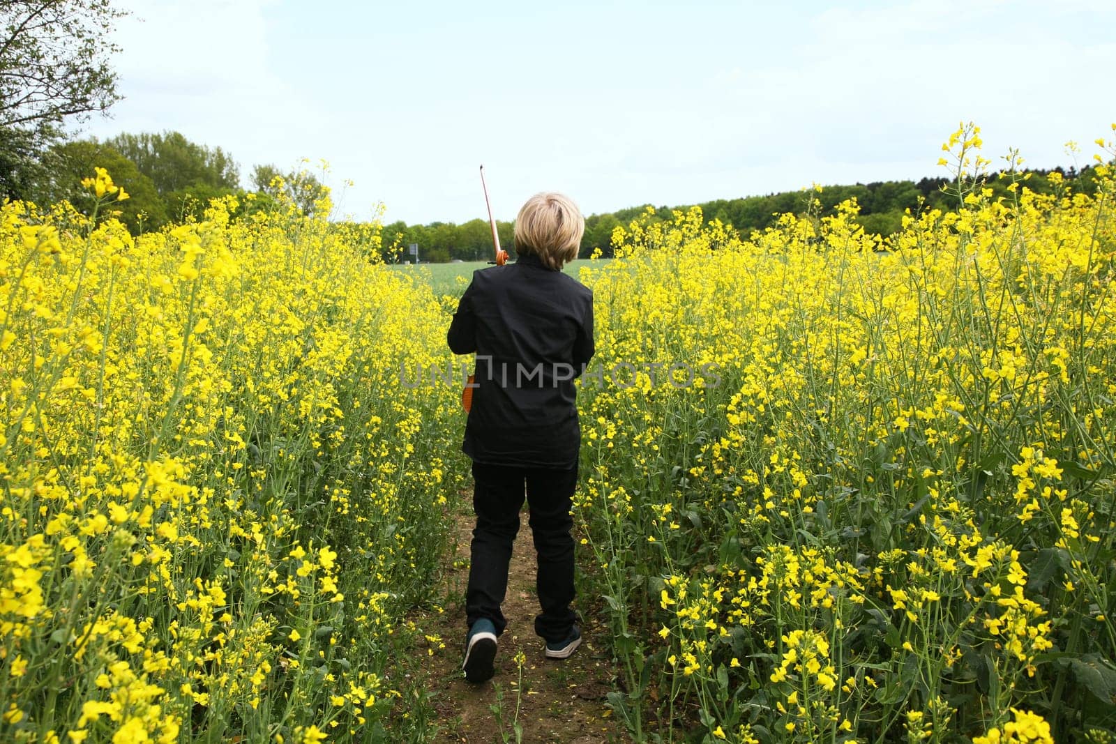 Boy from behind with violin