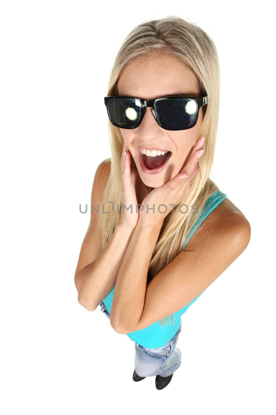 Gorgeous young lady in sunglasses looking up at the camera