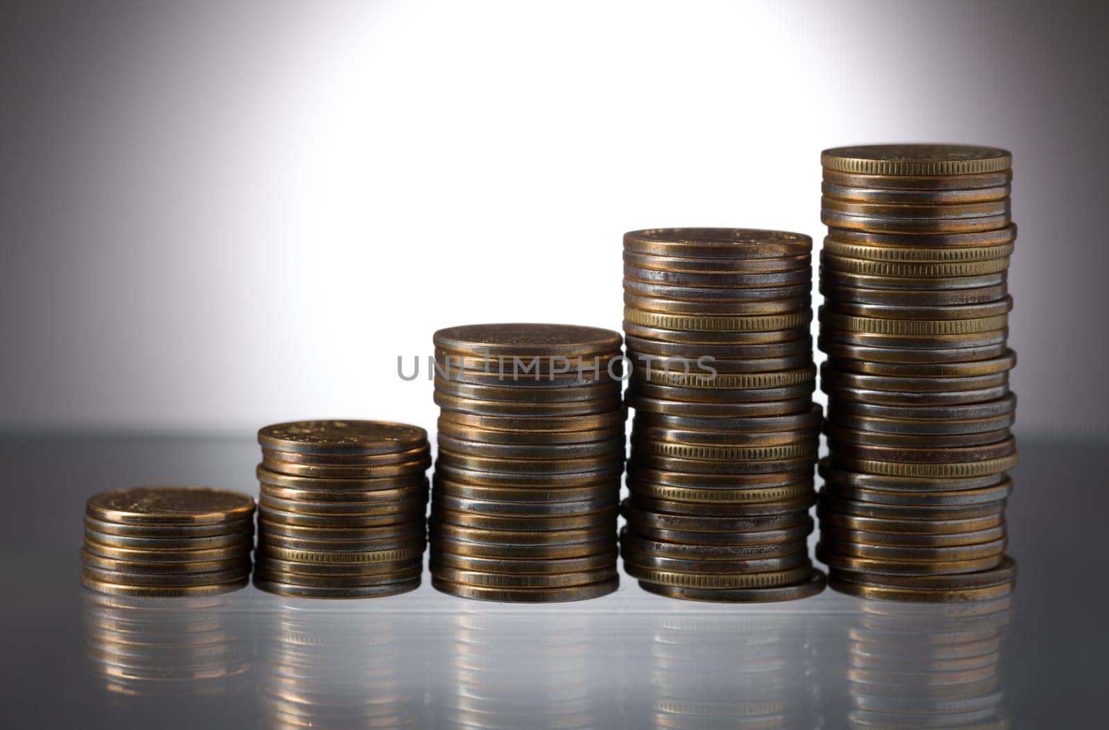 Stack of coins symbolizing financial success abstractly.