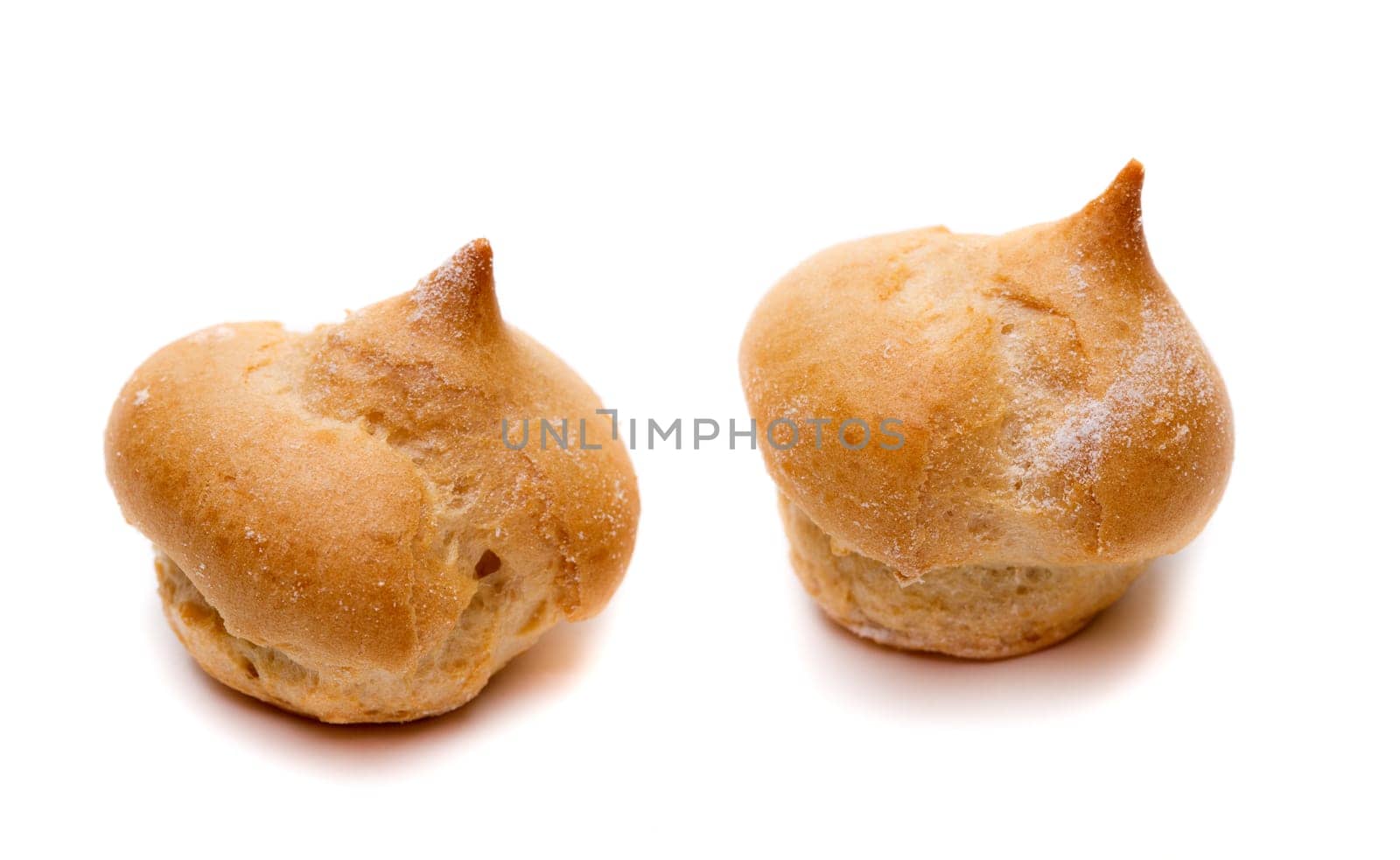 Two Cake profiteroles. Isolate on white.