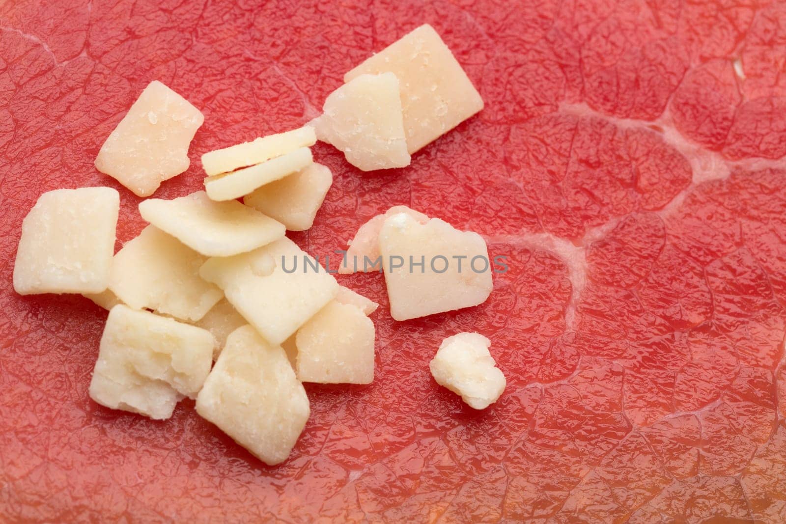 Italian aged cheese on the background of smoked meat