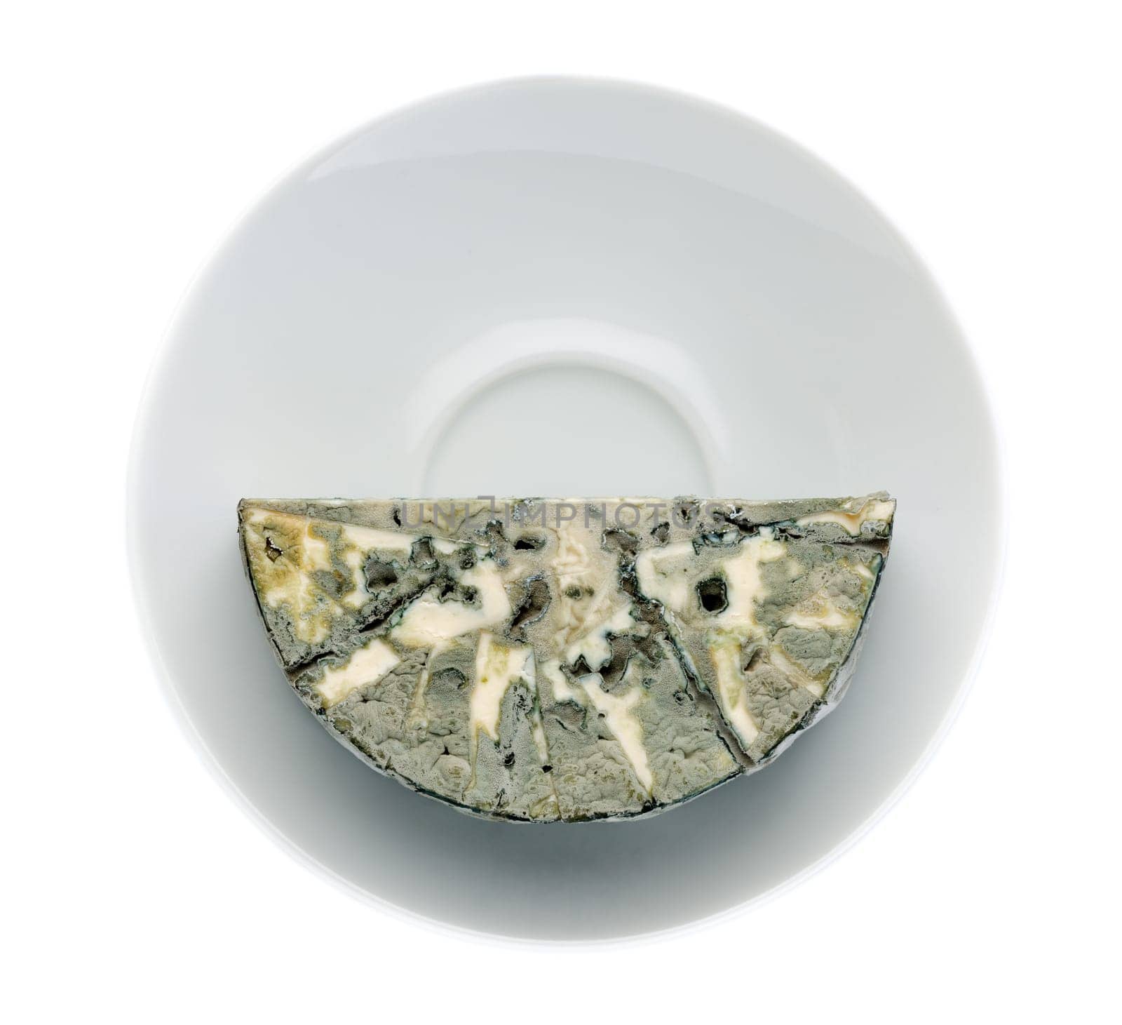 Cheese with black mold on the plate. Isolated on white background. View from above.