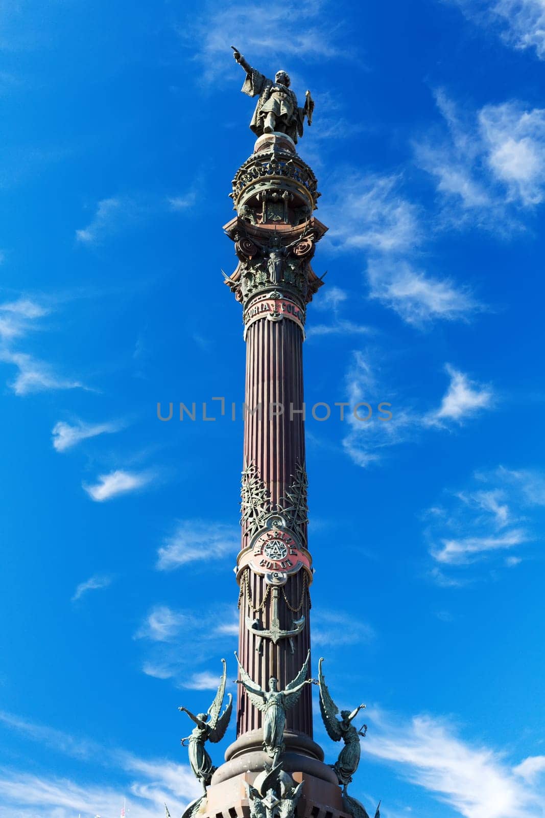 Statue of Christopher Columbus against a blue sky.