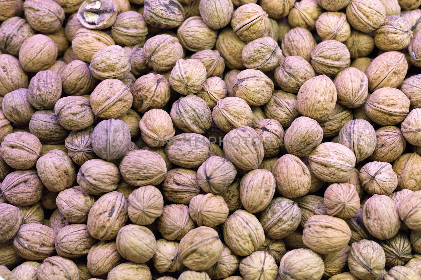 Background of raw walnuts in the market Rambla in Barcelona